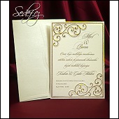 Dvoudílné svatební oznámení ve formě karty se zlatými ornamenty a s výseky